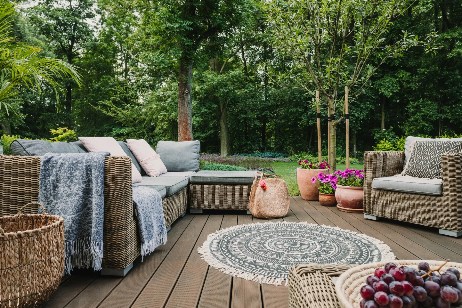 Composite decking outdoor living area with patio furniture and plants